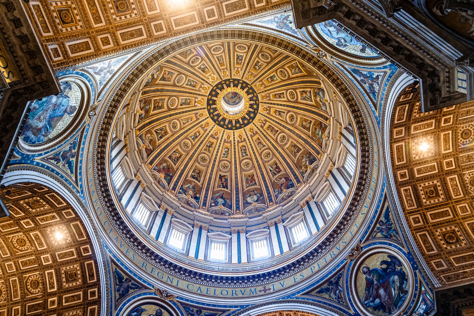 Intricate design of St. Peter's Basilica's dome captured from below, showcasing Renaissance artistry.