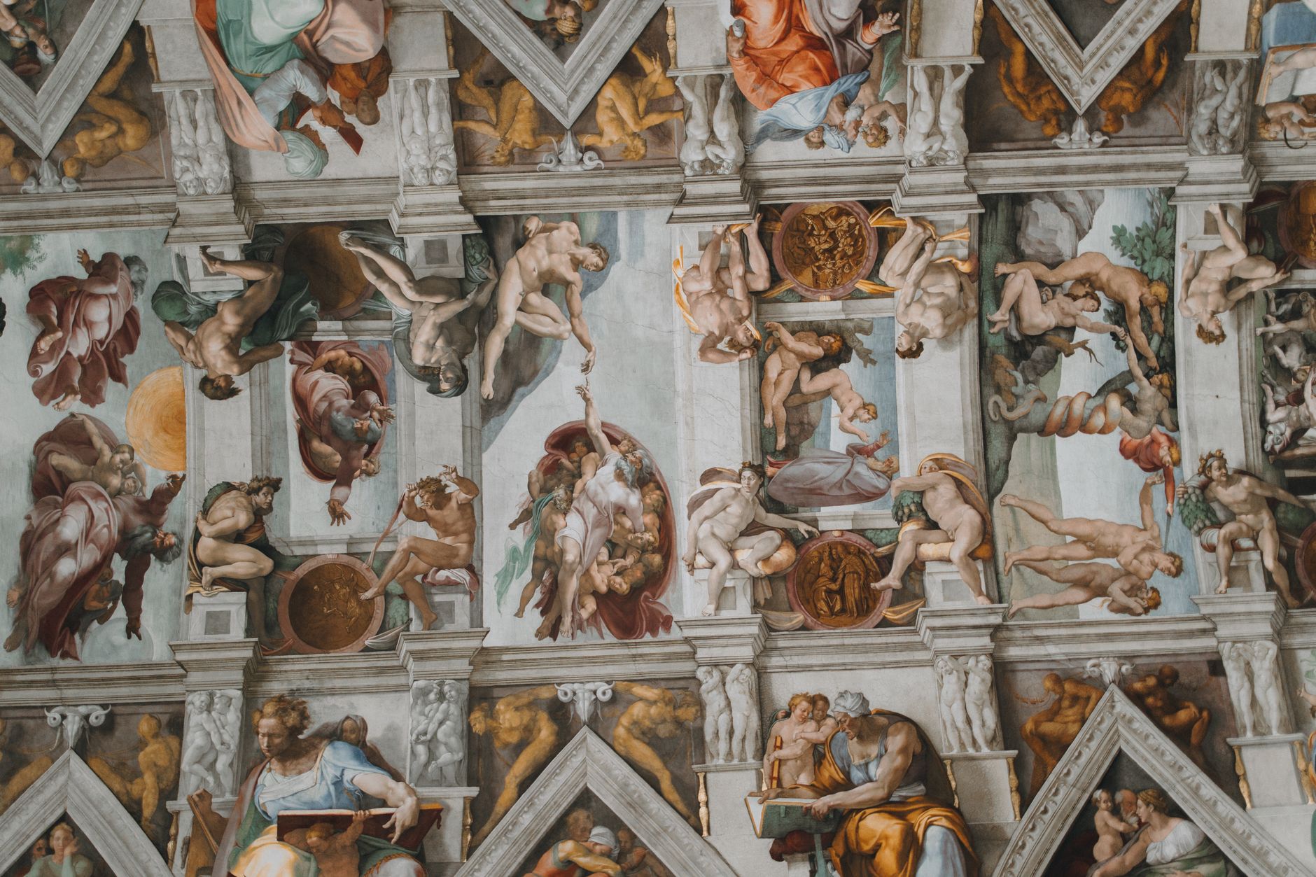 Intricate frescoes on the Sistine Chapel ceiling by Michelangelo, Vatican City.
